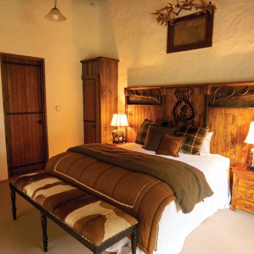 Interior of Kuranui Villa bedroom with elegant furnishings.